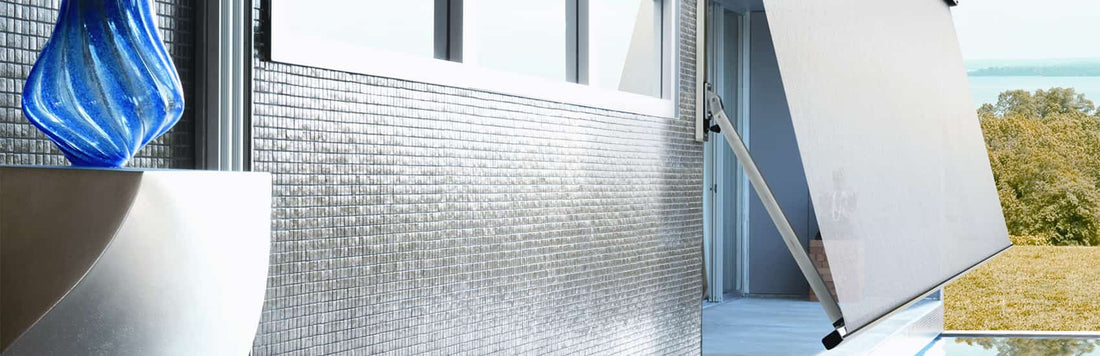 Elegant automatic awning extending over a modern balcony with a decorative blue vase.