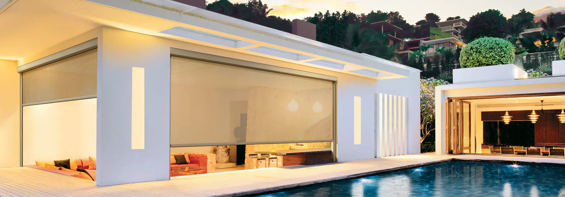 Modern house exterior featuring Windmaster blinds for patio and poolside protection.