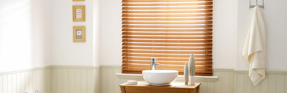 Warm wooden blinds in a stylish bathroom enhancing natural light and decor.
